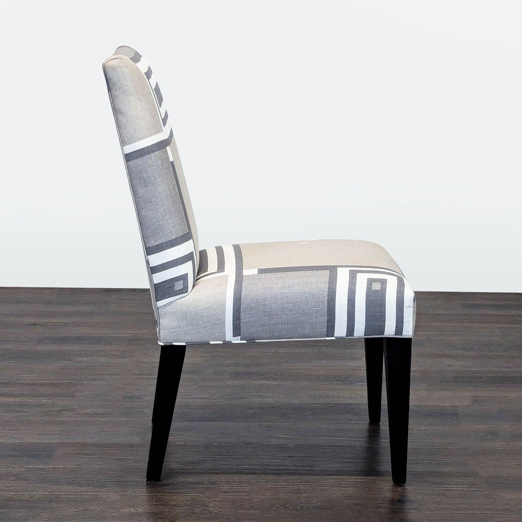 2. Modern upholstered dining chair by Mitchell Gold + Bob Williams, featuring clean lines and soft cushioning.