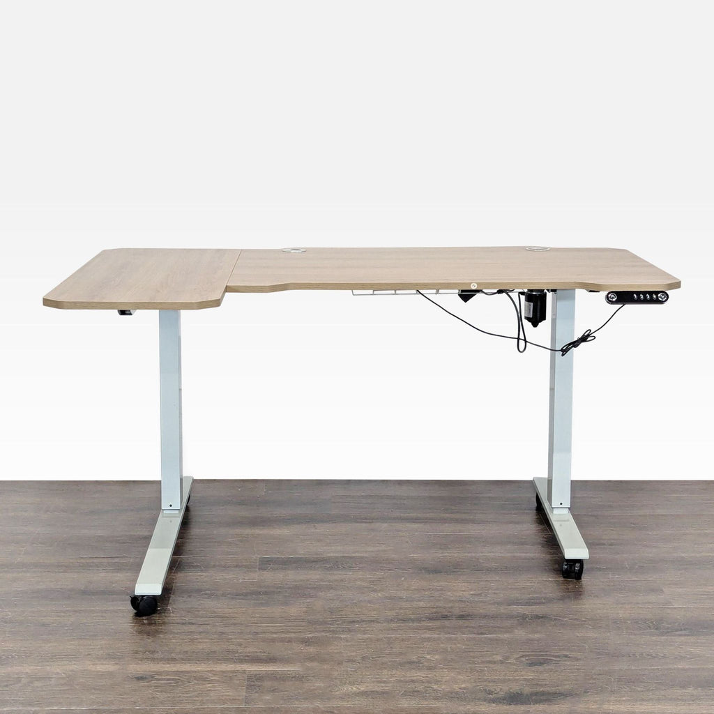 L-shaped HEONAM desk with light wood finish, electric height adjustment, metal legs with wheels, and cable management.