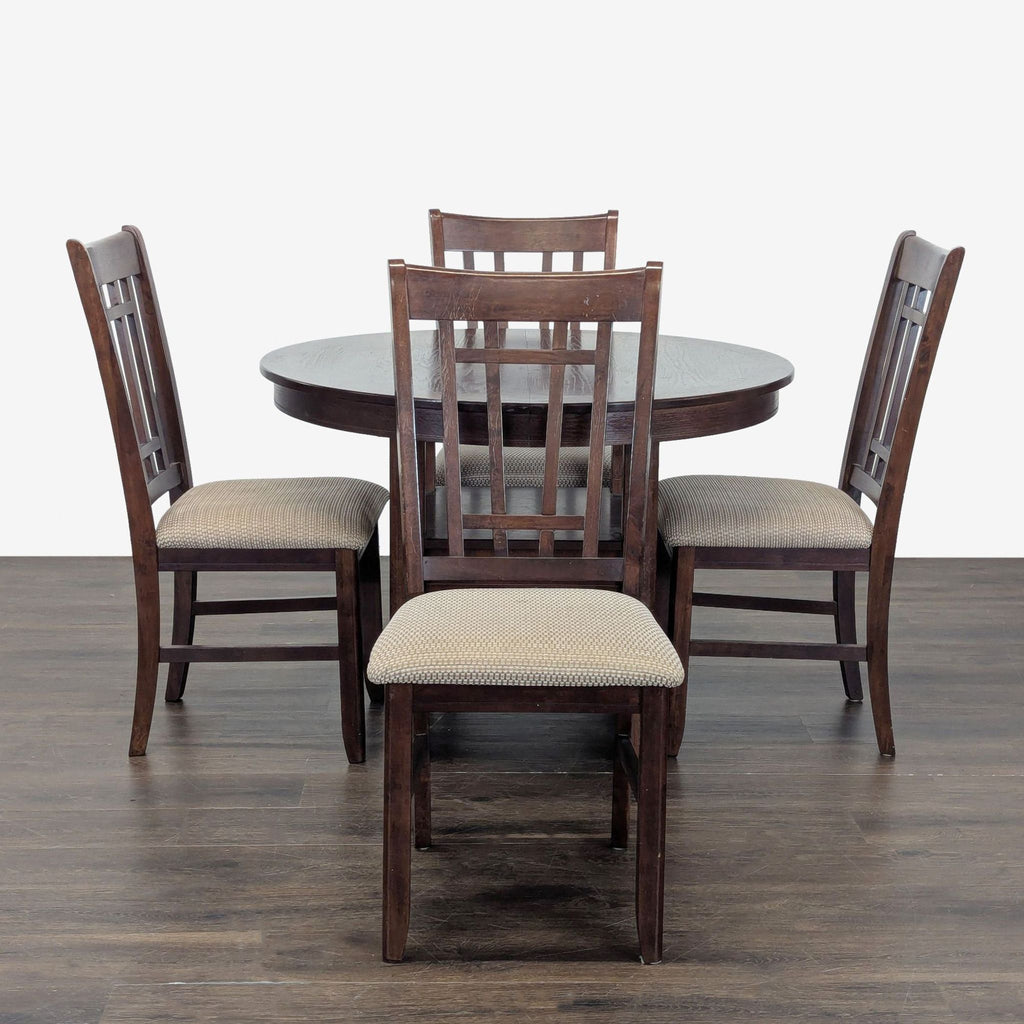 Round dark wood dining set with four cushioned chairs, featuring a lower storage shelf and slatted backs.