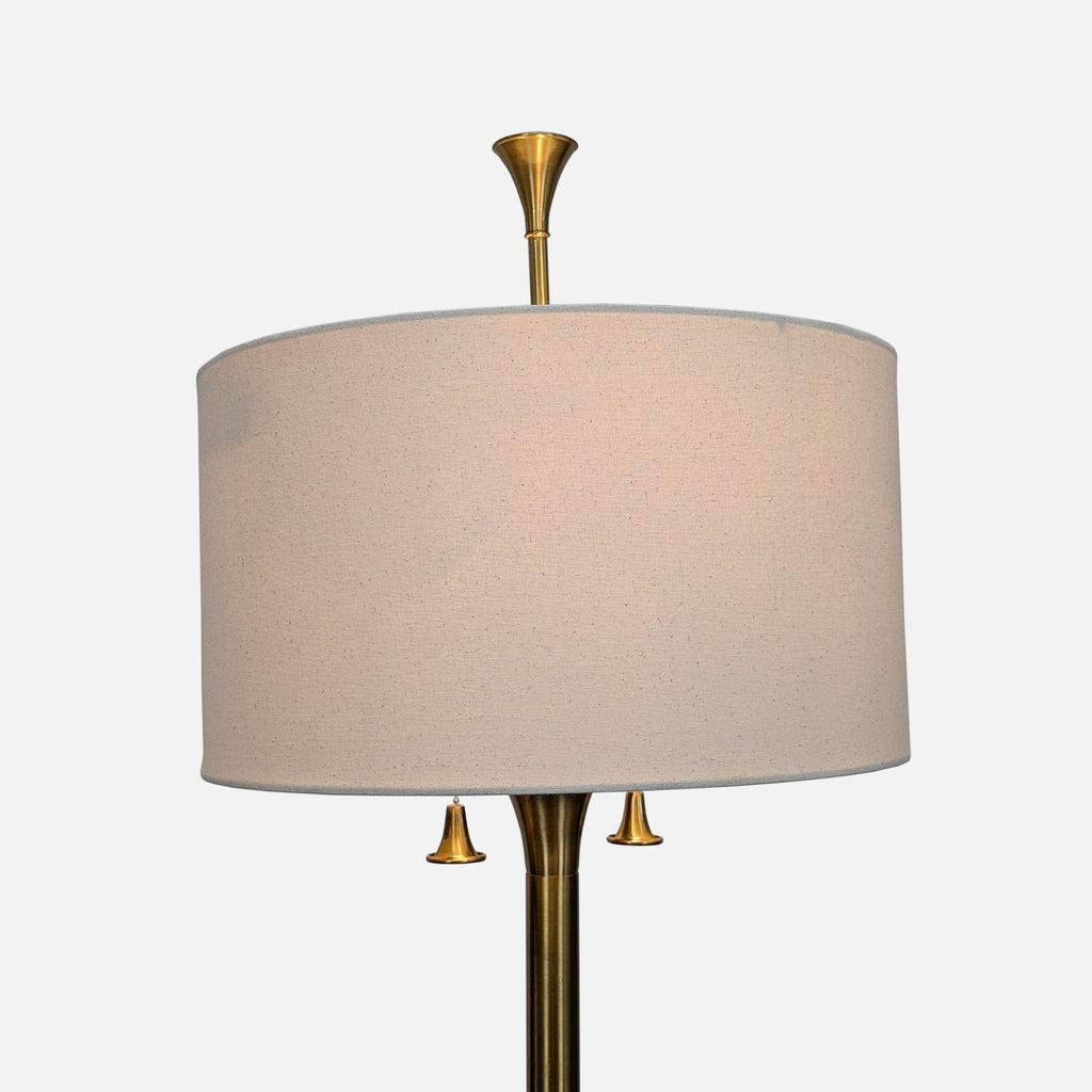 Modern floor lamp featuring a sturdy brass frame, simple white fabric shade, and two pull chain switches for convenience.