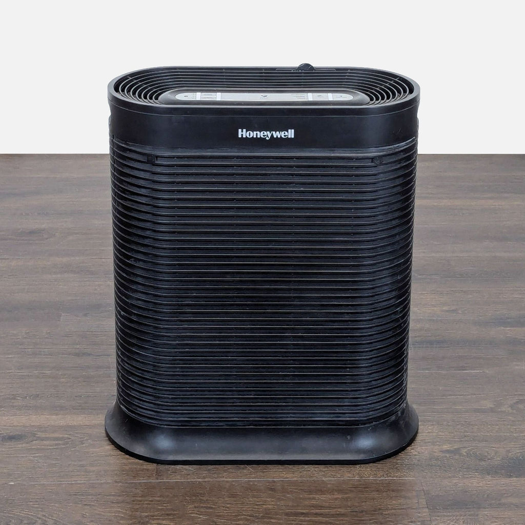 Honeywell tower air purifier with modern design, simple controls, and indicator lights for home or office use.