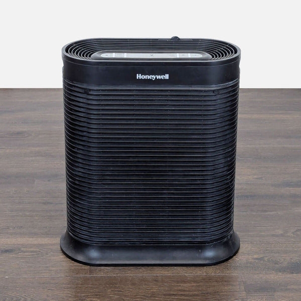 Honeywell tower air purifier with modern design, simple controls, and indicator lights for home or office use.