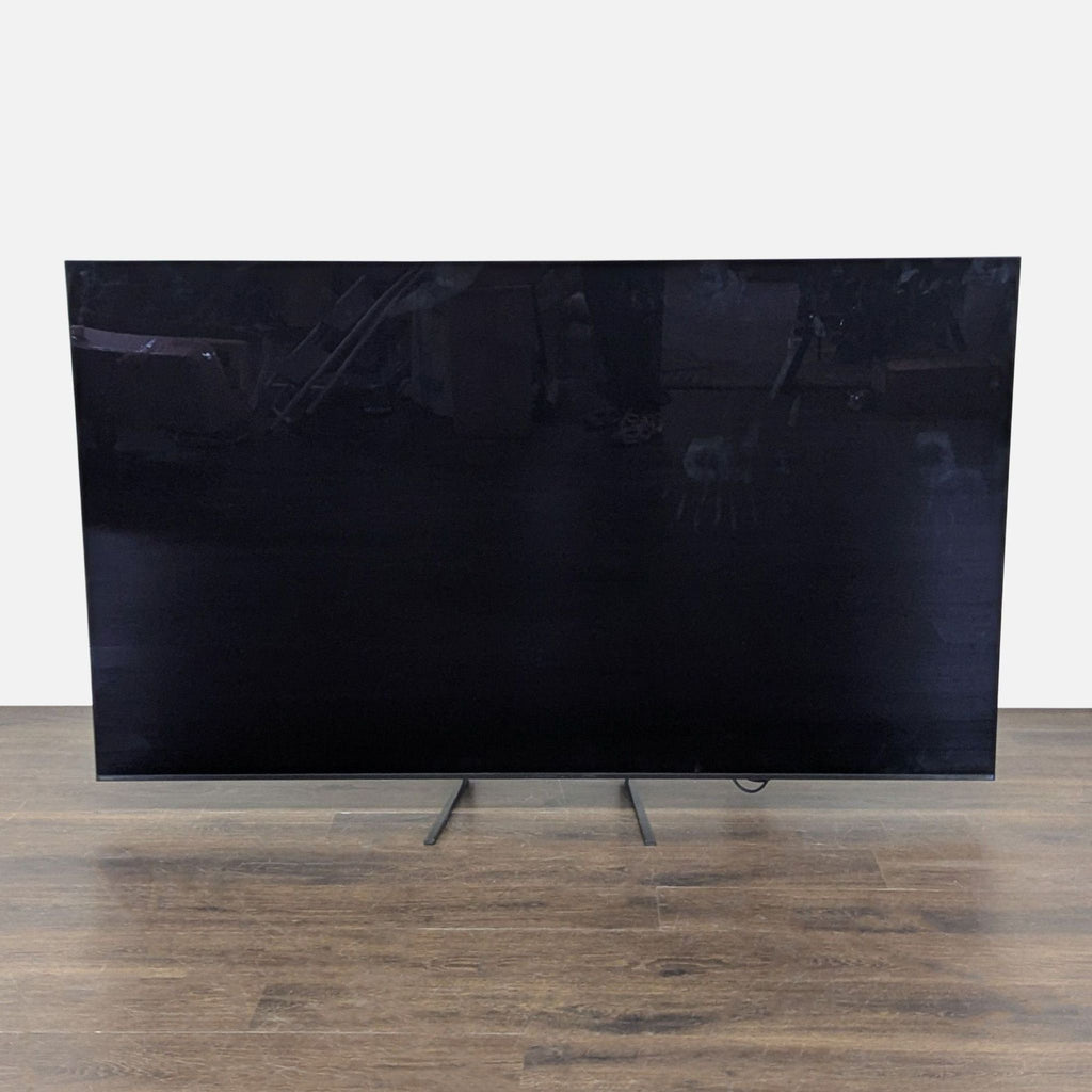 Sony 65-inch Ultra HD Smart TV on legs, perfect for streaming apps and home entertainment setup.