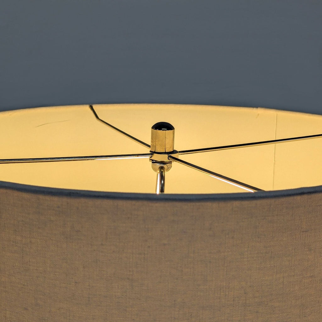 Beige Pottery Barn lamp featuring a tactile base and simple drum shade, perfect for living or bedrooms.