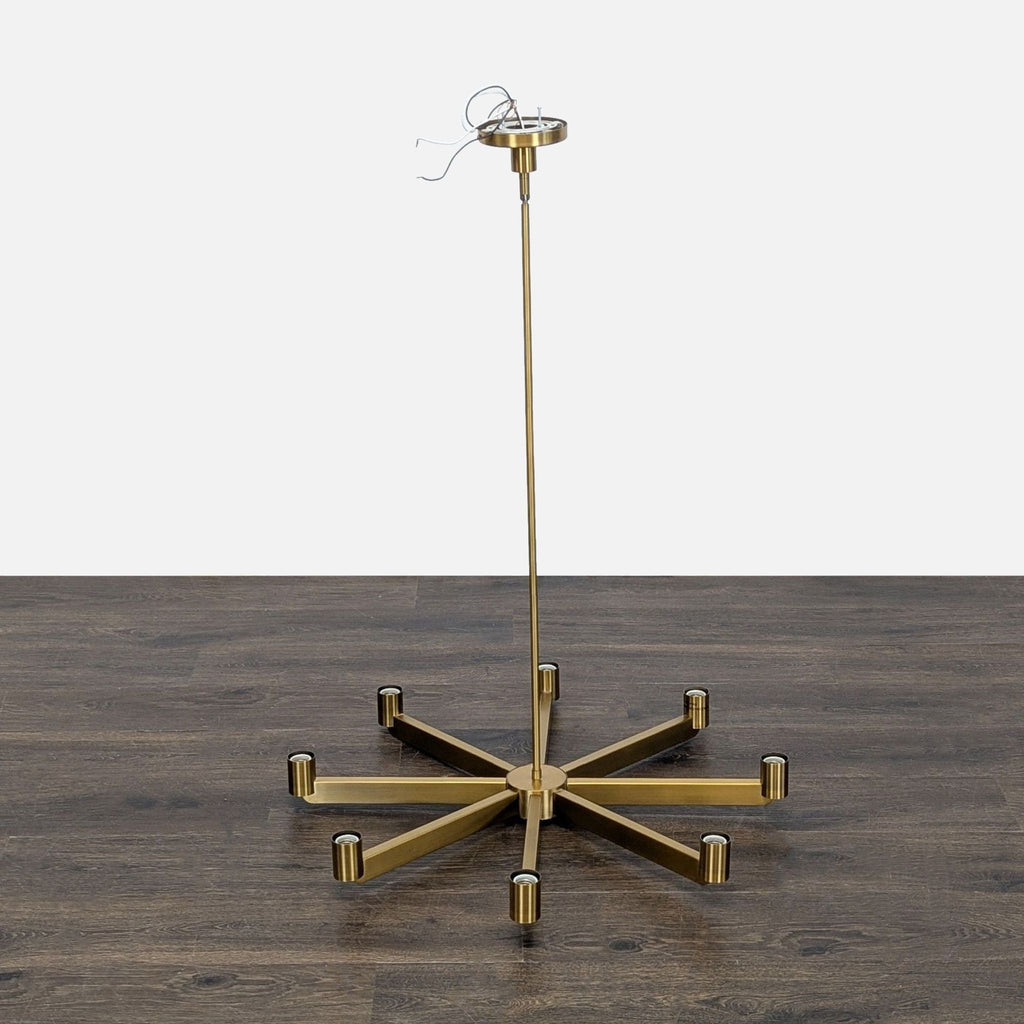 Sleek 8-light chandelier by Kuzco Lighting in brushed brass, perfect for modern dining or living rooms.  