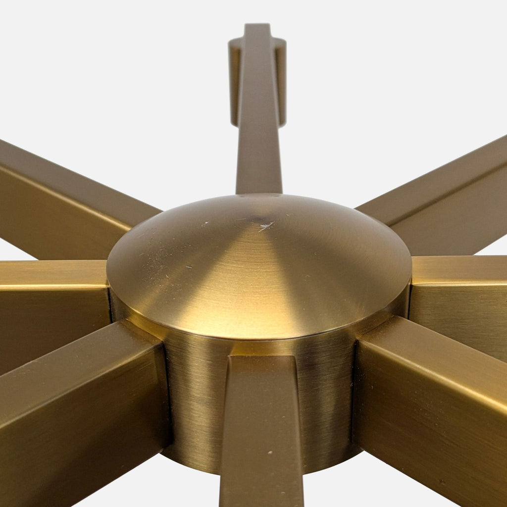 Modern minimalist chandelier from Kuzco Lighting in a brass finish, suitable for stylish home interiors.  