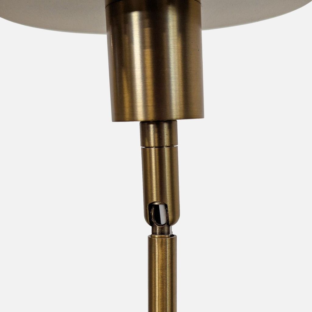 Kuzco Lighting 8-light chandelier with a contemporary brass look, ideal for entryways or dining areas.