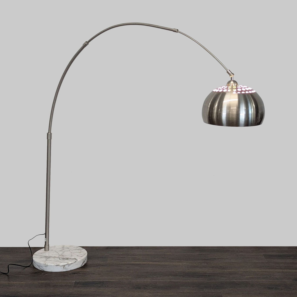 Modern EQ3 arc floor lamp with a brushed metal dome shade and marble base for stylish living room lighting.  