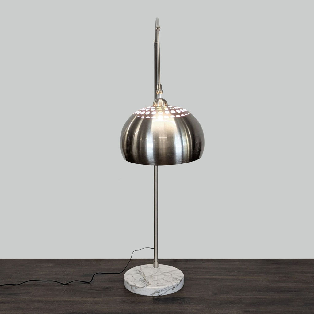 EQ3 adjustable floor lamp featuring a metal dome shade, marble base, and plug-in design for versatile lighting.  