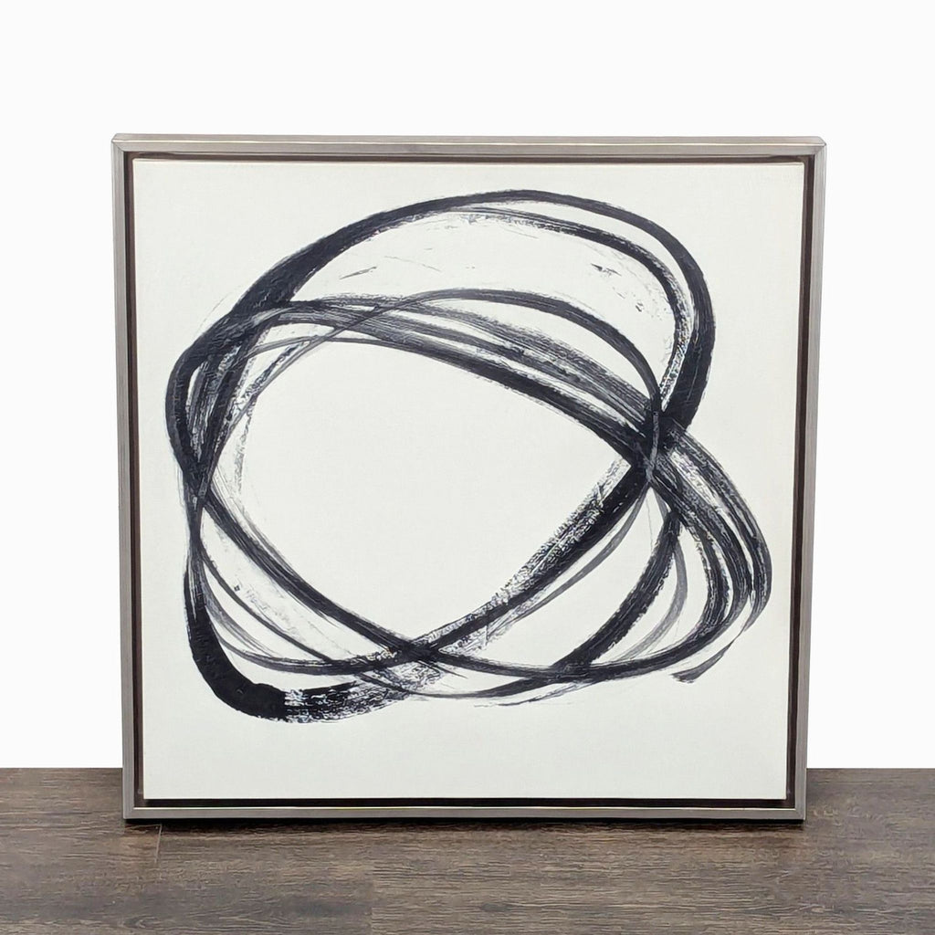 1. Framed modern abstract painting with bold black brushstrokes swirling on a white background, perfect for décor.