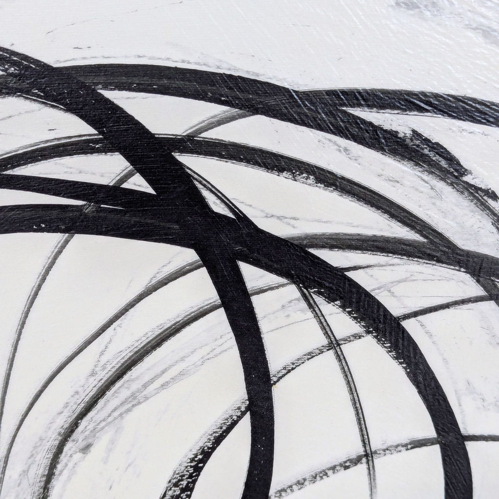 Modern abstract wall art showing dynamic black swirl patterns on white, suitable for contemporary spaces.