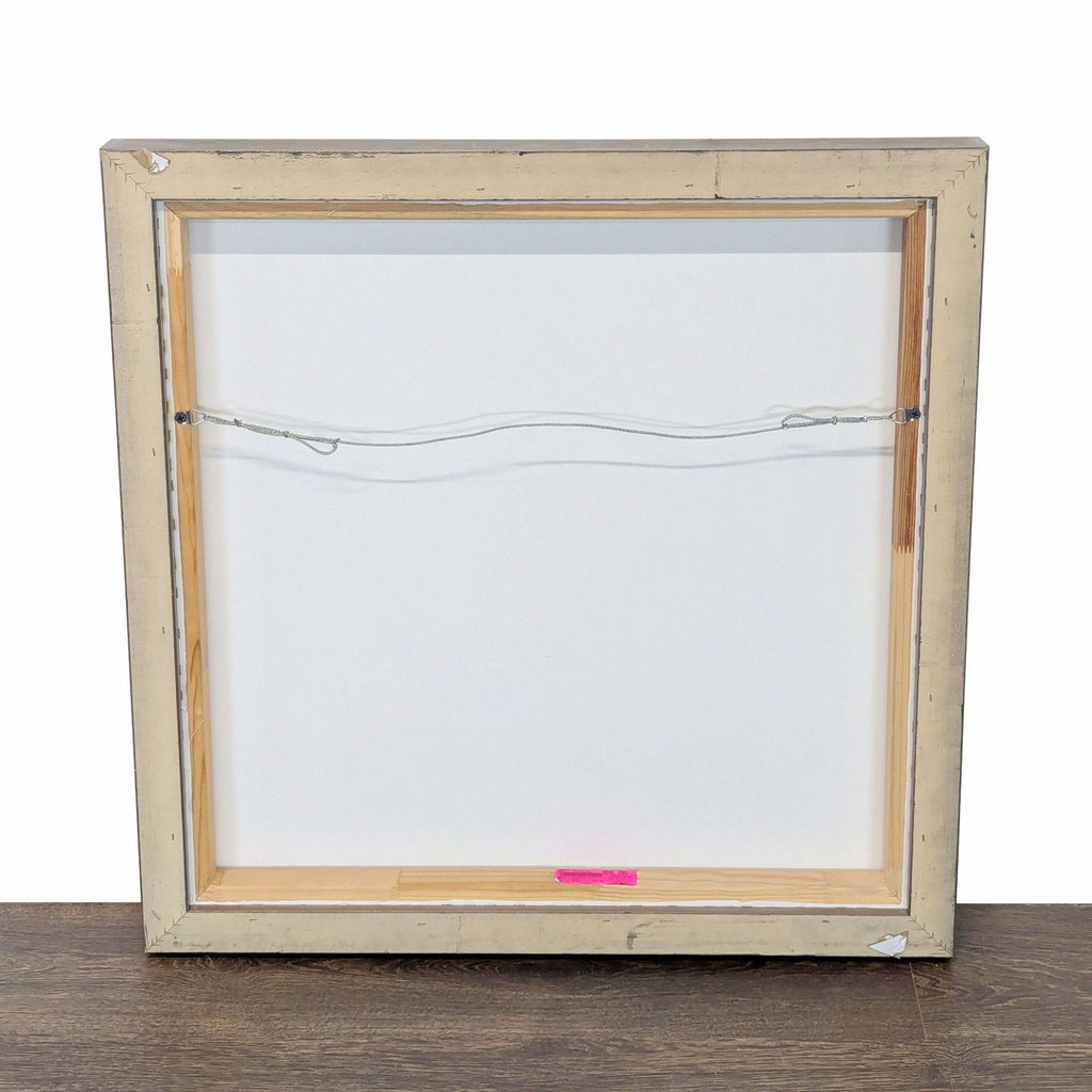 Minimalist abstract artwork with strong black lines on white, professionally framed for stylish display.