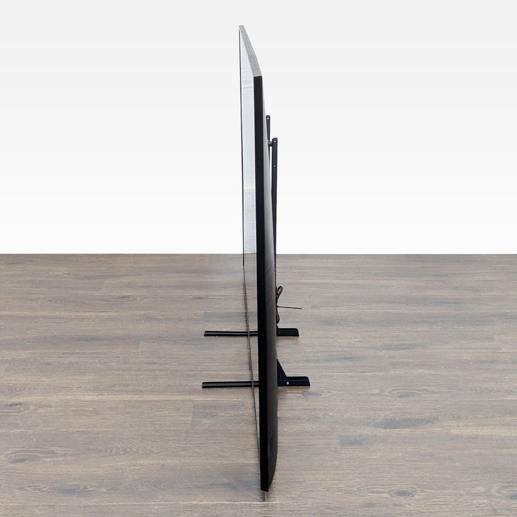 Samsung 65-inch Smart TV with sturdy legs, crisp Ultra HD screen, and stylish black frame.