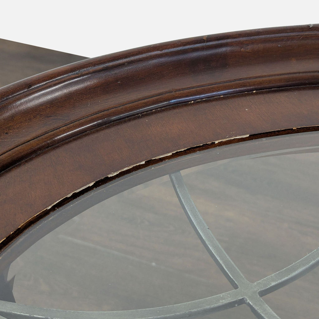 2. Close-up of coffee table edge highlighting chipped and worn wood finish near the glass top.