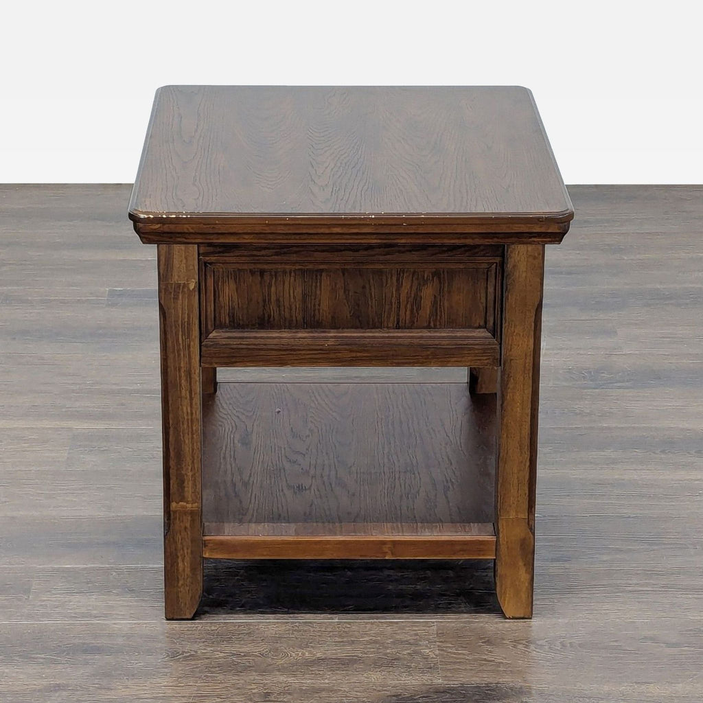 3. Ashley Furniture end table, perfect for small rooms, with minimalist design and ample bottom shelf space.