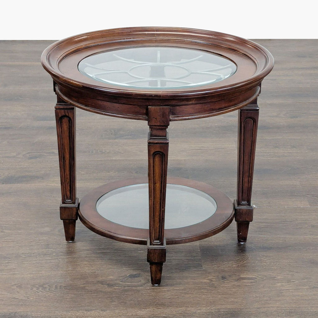 2. Traditional round end table in dark wood with a decorative glass insert on top and a matching lower shelf.  
