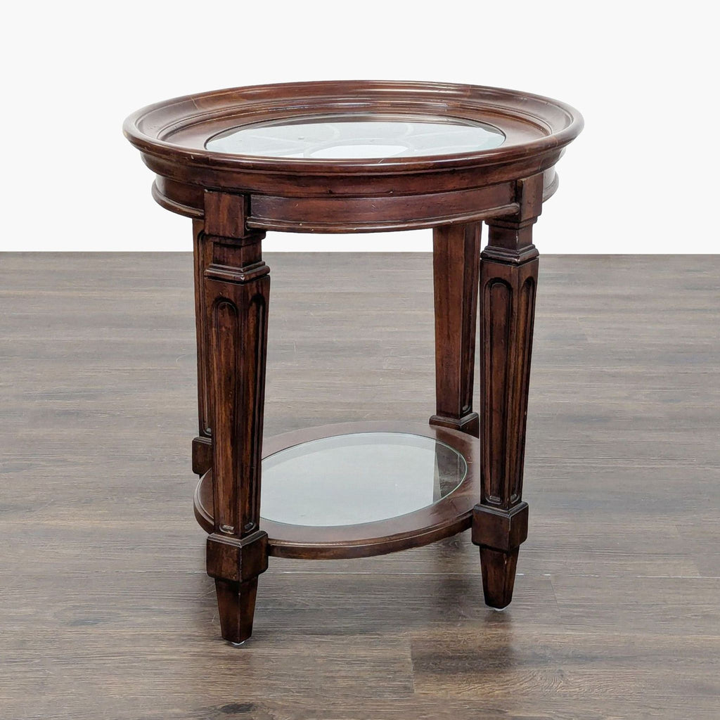 1. Round wooden end table with a glass top and lower glass shelf, featuring carved legs and classic style.  