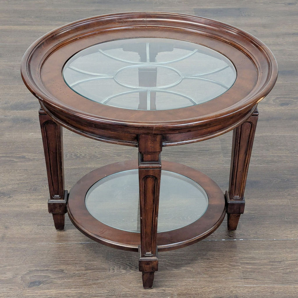 3. Overhead view of a classic round end table, showing wooden frame, glass tabletop with pattern, and lower shelf.