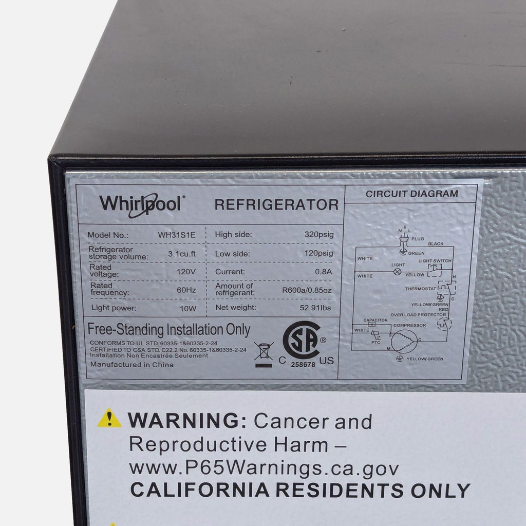 Whirlpool small refrigerator in silver, ideal for dorms or offices, with distinct freezer and fridge compartments.