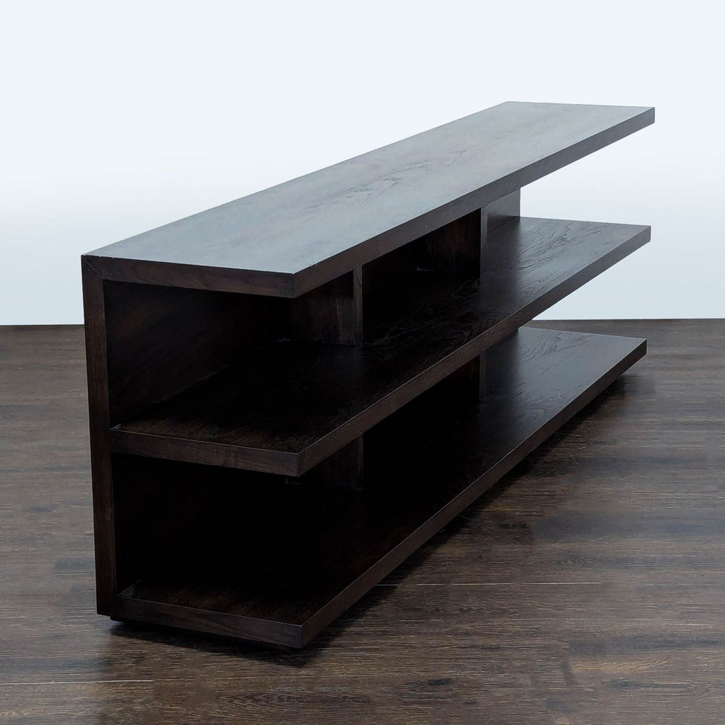 Contemporary bookshelf in dark finish, features spacious shelves for organized storage and stylish living.
