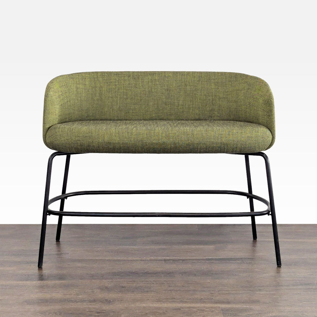 1. Olive green upholstered bench with curved back and black metal legs, designed by Form Us With Love for High Tower Design.  
