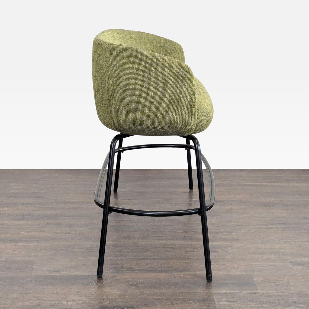 2. Side view of a modern green bench with rounded edges and black metal frame, from High Tower Design’s stool collection.  