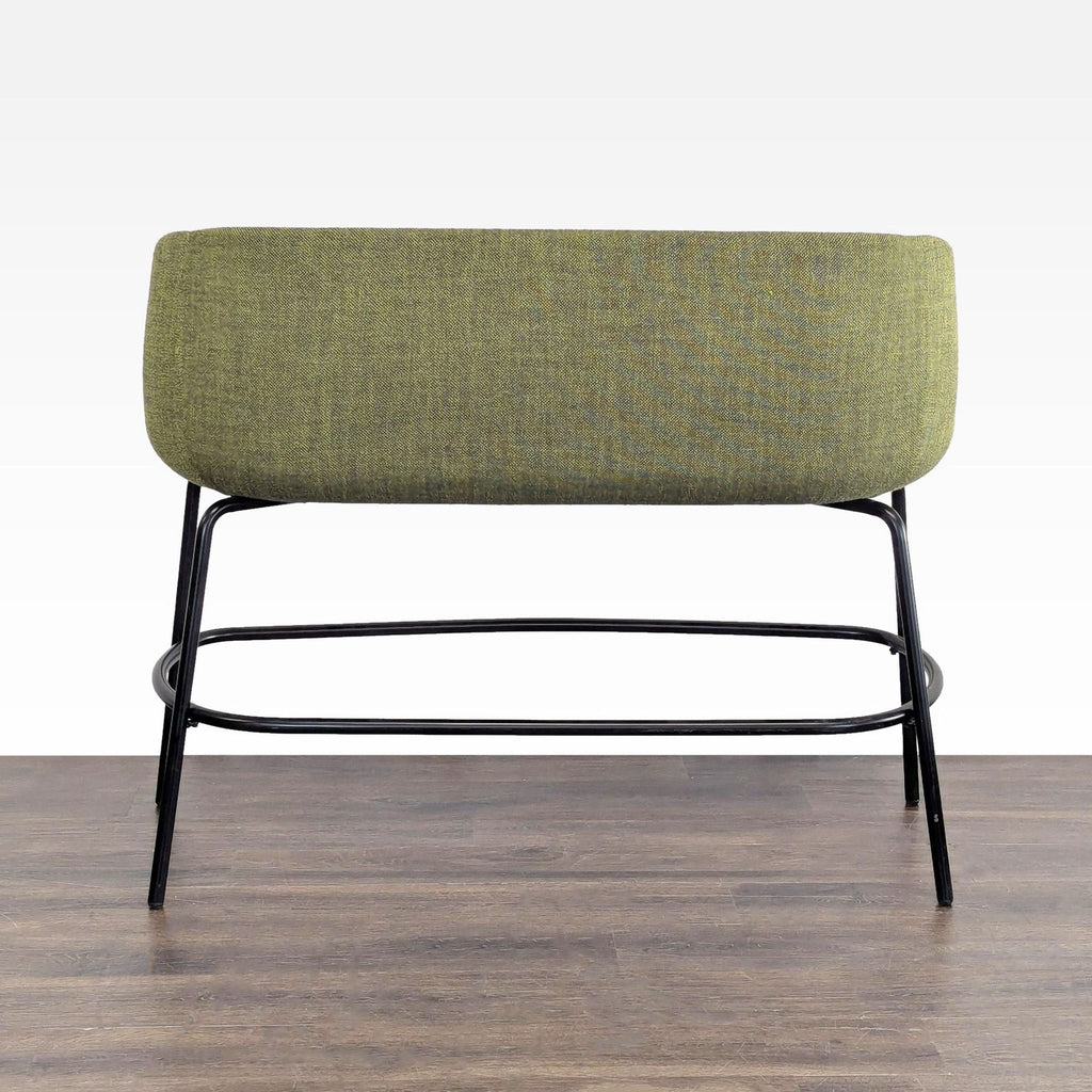 3. Rear view of an olive green, plush bench with black metal legs, designed by Form Us With Love, High Tower Design.