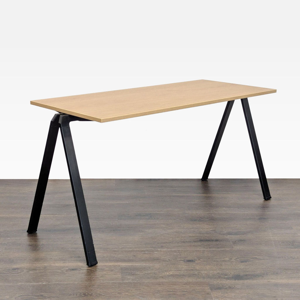 Modern Bernhardt desk with light wood top and black metal legs, perfect for home or office workspace.