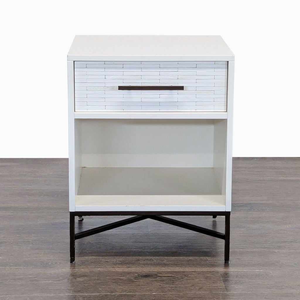 1. West Elm end table with whitewashed, hand-inlaid wood tiled drawer, open shelf, and metal base, front view.