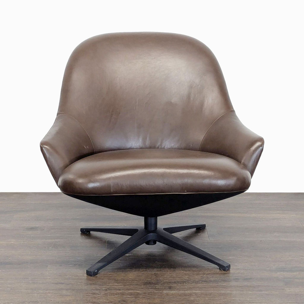 Front view of Article lounge chair with soft brown leather, curved seat, and modern swivel base for comfort.