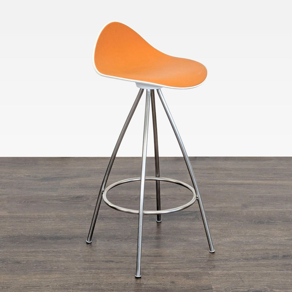 2. Angled view of a Stua brand orange seat stool with chrome legs and footrest, for Stools, Ottomans & Benches.