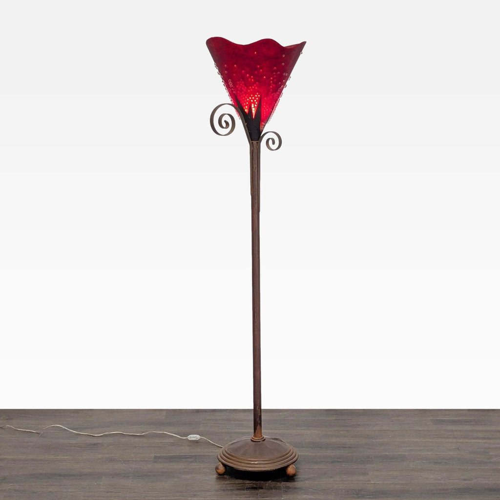 1. Tall floor lamp with a decorative metal base and a bright red glass shade featuring bubble details.  