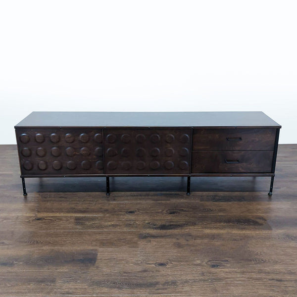 Modernica Eames-style storage unit with painted panels, dimpled plywood doors, and black steel supports.