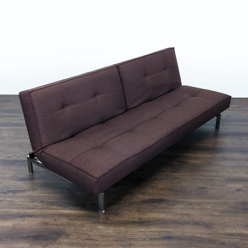 Contemporary fabric sofa by Innovation, blends with any decor and converts to a bed for guest use.