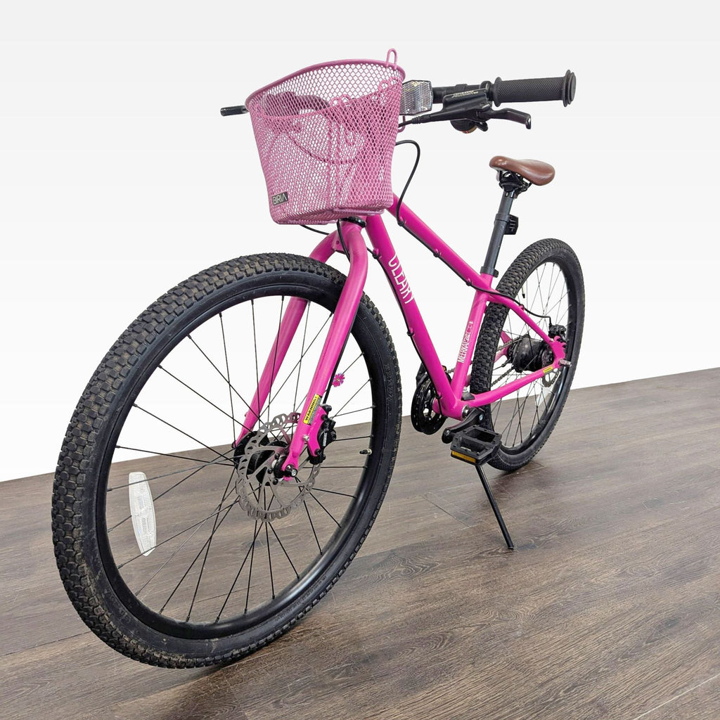 Cleary youth bike in bright pink, featuring basket, comfy seat, disc brakes, and durable frame for daily rides.