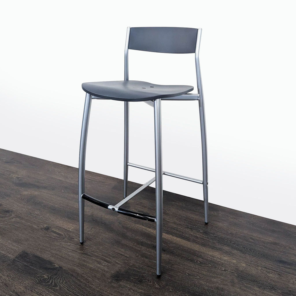 Sleek Altek Italia Design stool in tapered brushed nickel steel, ideal for modern spaces.  