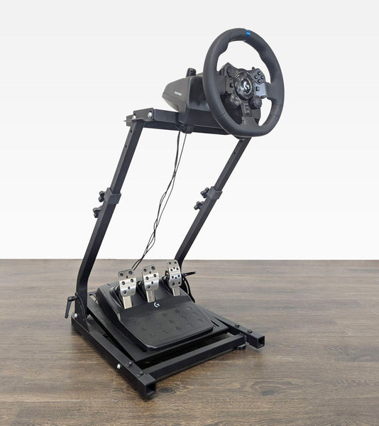 Logitech G923 gaming steering wheel and pedals set, like new, shown on a compatible stand for PlayStation and PC.