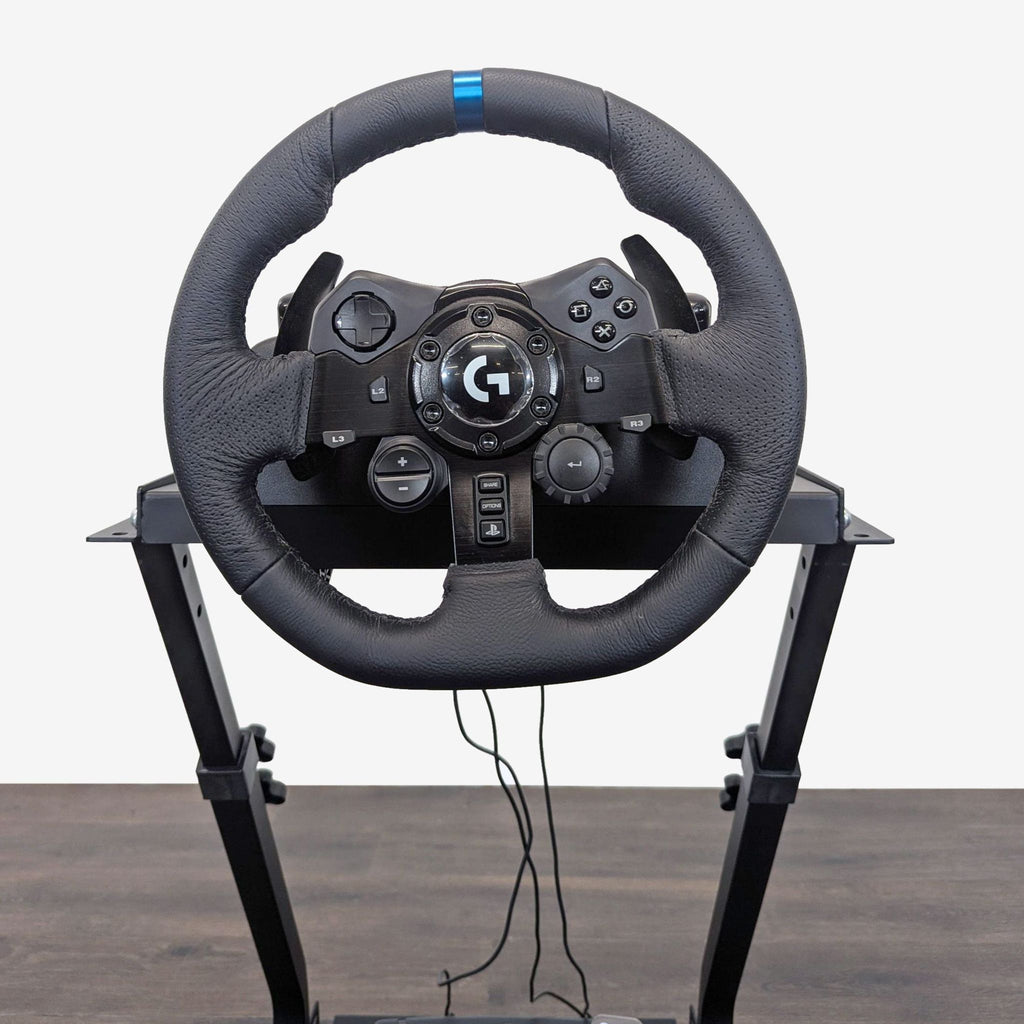 Complete Logitech G923 wheel and pedal setup with adjustable stand, in excellent condition, ideal for racing games.