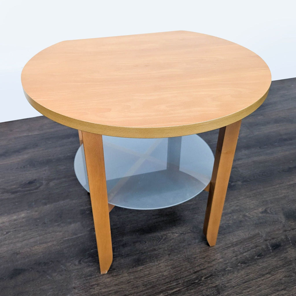 2. Light wood end table featuring a round top and a frosted glass shelf underneath, shown from above.