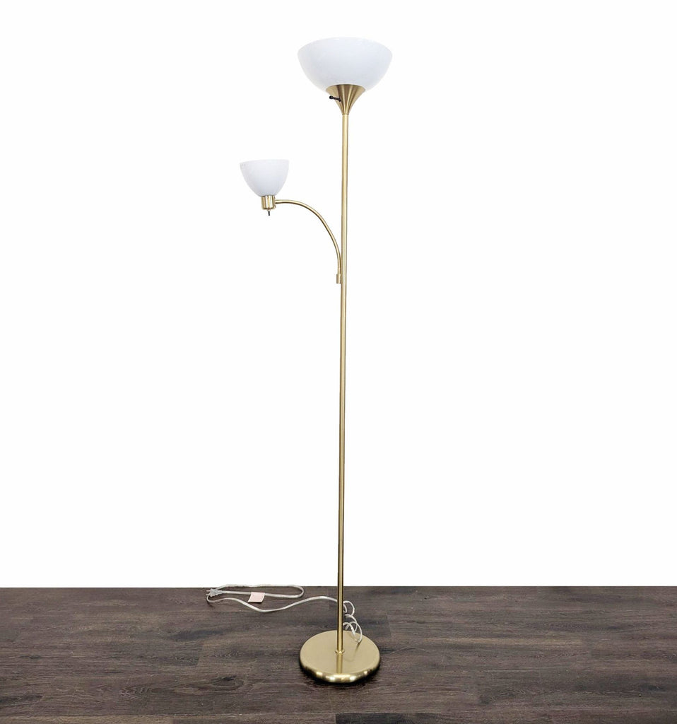Brightech floor lamp in brass with two white glass shades and a sturdy base, ideal for living rooms.