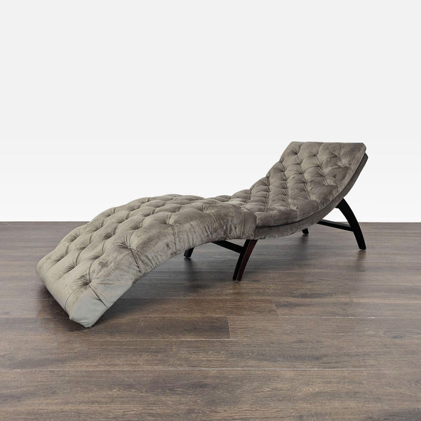 Gray velvet tufted lounge chaise by Noble House Home with a curved design for stylish relaxation.