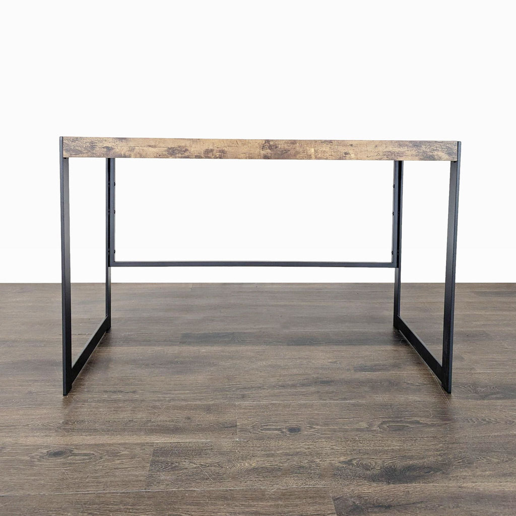 Modern Coaster desk with rustic wood top and black metal frame, ideal for a home office or study.  