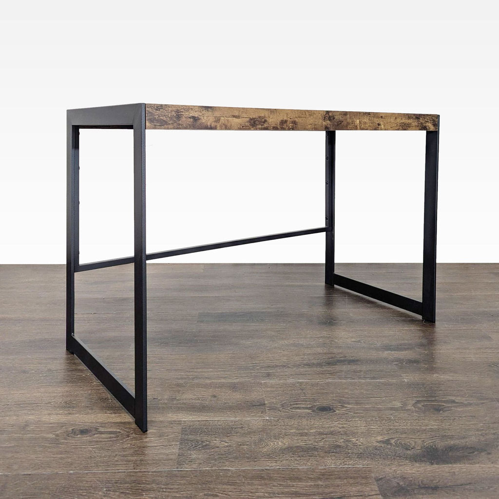 Simple Coaster desk featuring a sturdy black frame and spacious wood-finished surface for work essentials.  
