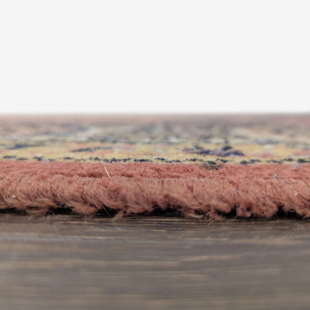 Traditional-style rug with intricate motifs, warm colors, and a patterned border, approximately 6.5x10 feet in size.