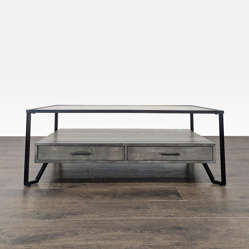 Industrial coffee table featuring two drawers and a sturdy metal frame.