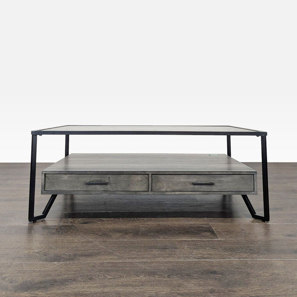 Industrial coffee table featuring two drawers and a sturdy metal frame.