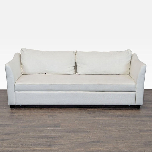 Modern cream Pottery Barn sleeper sofa with clean lines, plush cushions, and a hidden pull-out bed.