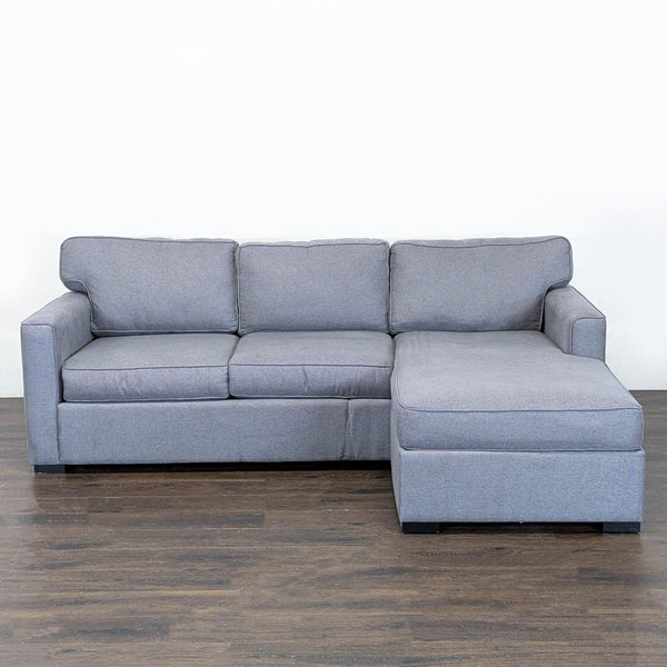 1. Gray Jonathan Louis sectional with right-facing chaise, firm cushions, and modern style on wood flooring.