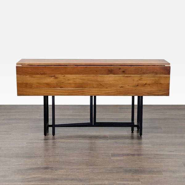 Rectangular Acacia wood dining table with metal legs, seats 4-6 with leaves, by Crate & Barrel.