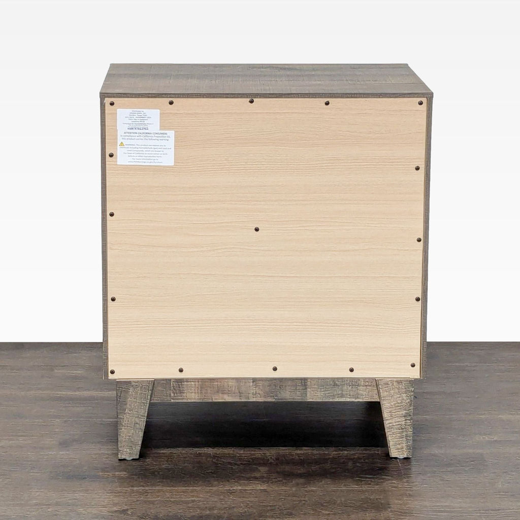 3. Back view of Crown Mark end table, light wood panel with visible screws and informational label.